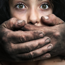 Hands protecting a child